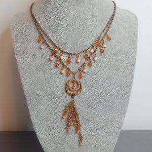 Beaded Necklace. 2-tier, Pink/Coral beads on copper-tone metal chains.